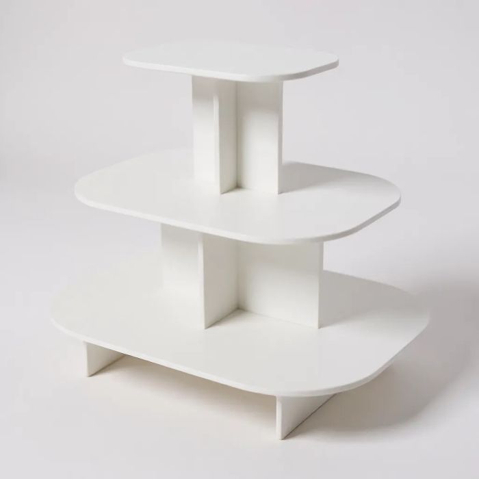 Pyramída oval - 3 laga borð. Hvítur melamín. L 120 x D 90 x H 106 cm. Rúnnað pallur 3 stig