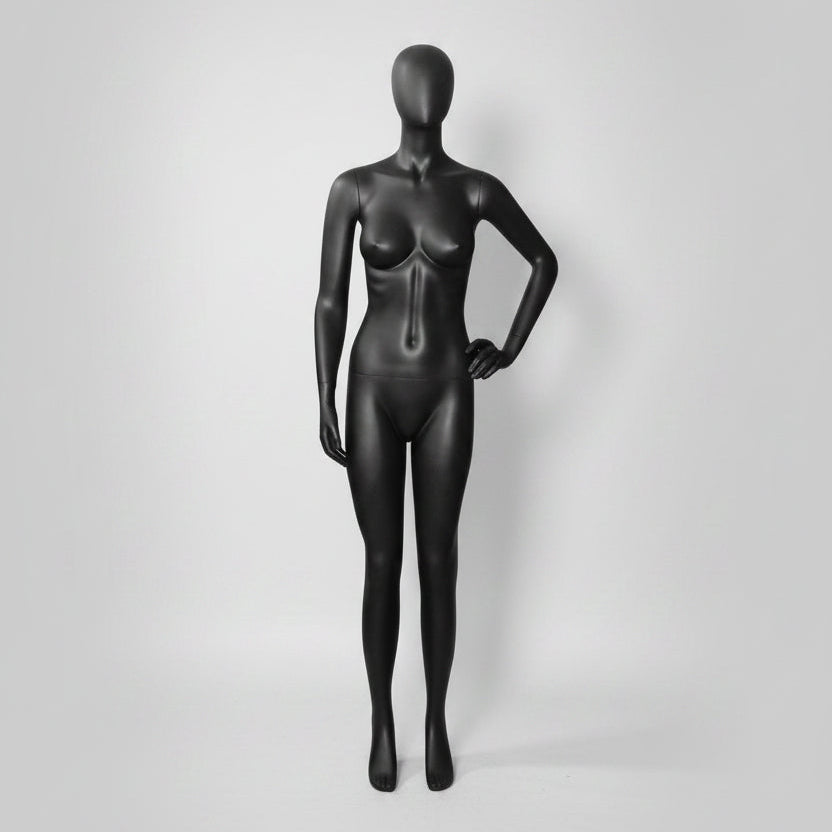 Kvennaklæðning, svart með faceless höfði. Handleggur hvílir á mjöðm. K&Q