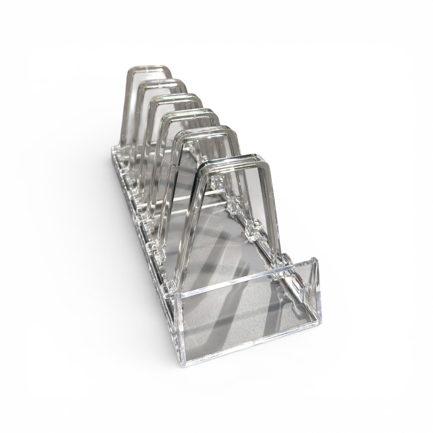 Stoð fyrir 6 stk. bók/diskur, glær, H11,5cm