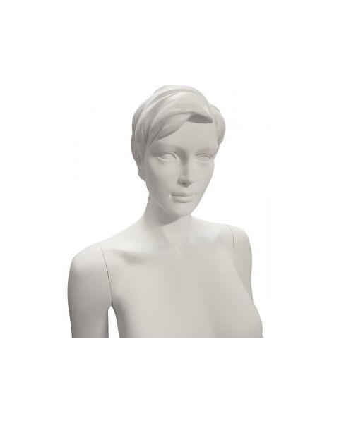 Dömugína, raunveruleg. Hvít, með höfuð, andlitsdrætti og mótað hár. Kringlótt fótplata. Stendur bein, tyllir á tá.